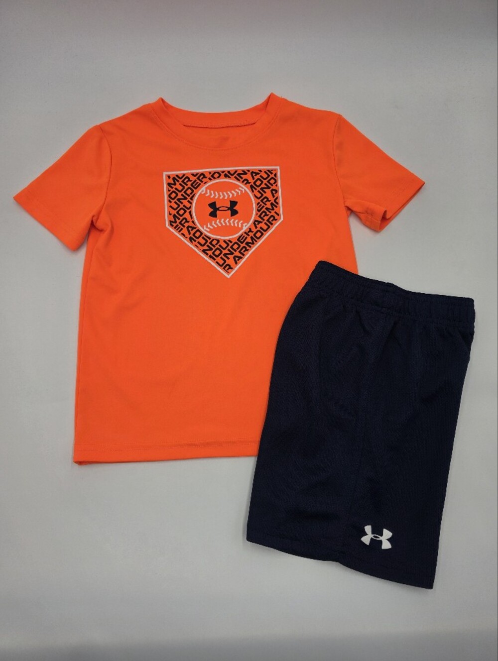 Under Armour boys' orange baseball tee and navy athletic shorts size 5